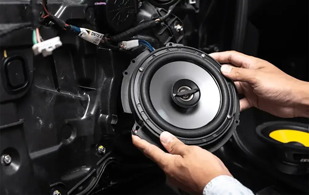 Fitting a speaker into a door card